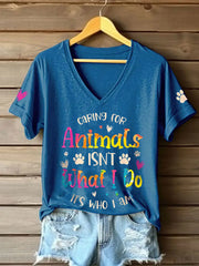 Women's caring for animals isn't what I do it's who I am V-neck T-shirts