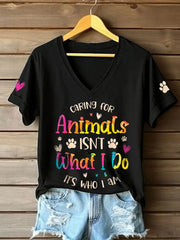 Women's caring for animals isn't what I do it's who I am V-neck T-shirts