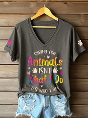 Women's caring for animals isn't what I do it's who I am V-neck T-shirts